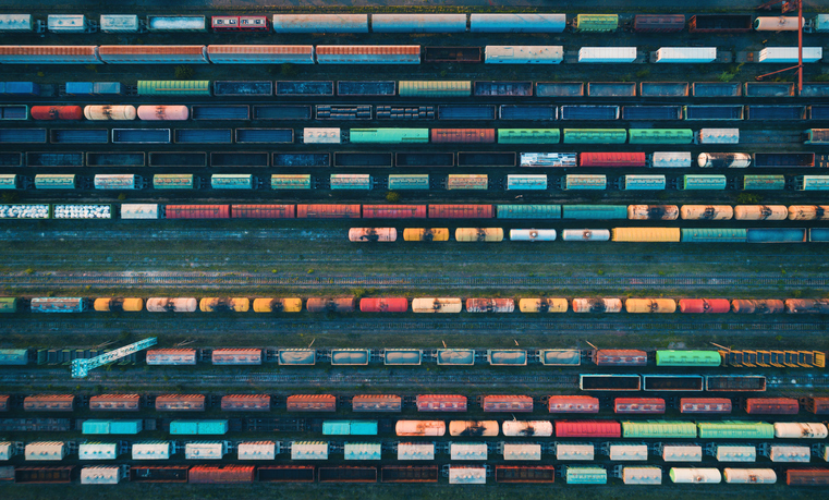 Aerial view of colorful freight trains on the railway station