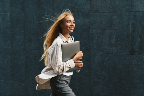businesswoman holding a laptop