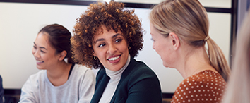 Picture of three woman talking in office