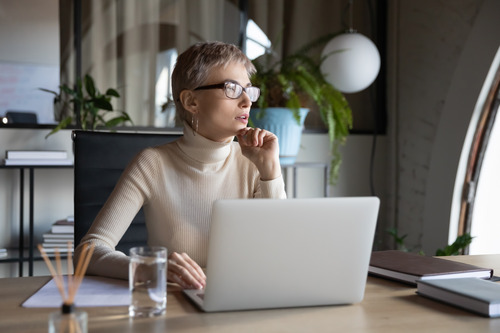 businesswoman in front of a laptop